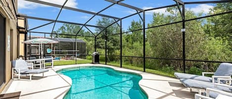 The pool area is a serene haven that boasts ample space and breathtaking conservation views, offering the perfect setting.