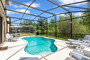 The pool area is a serene haven that boasts ample space and breathtaking conservation views, offering the perfect setting.