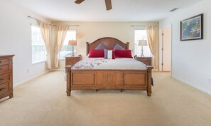 Large master bedroom with king size bed, walk-in closet and en suite bathroom