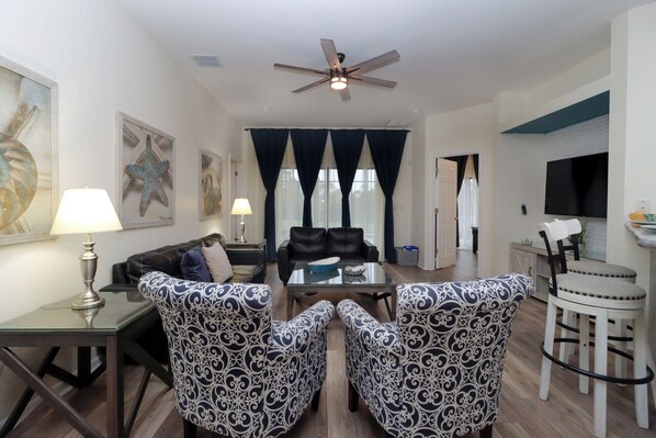 The beautiful pool view is the perfect backdrop, enhancing the room's serene ambiance and making it an ideal spot for both casual lounging and entertaining.