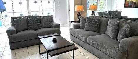 Step into the heart of the home with the open and inviting living area, designed to provide both comfort and style for guests to unwind, relax, and enjoy each other's company.