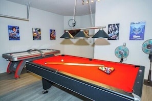 Exciting game room with Pool table and foosball