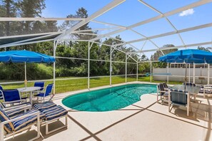 The outdoor pool area is a tranquil, resort-style retreat, designed to offer a perfect blend of relaxation, entertainment, and al fresco dining.