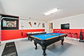 The fun-filled games room is a vibrant hub of entertainment and excitement, designed to bring people together for endless hours of laughter
