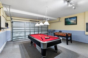 This vibrant and spacious room is packed with exciting activities, making it the perfect spot for friends and family to come together and enjoy some friendly competition.