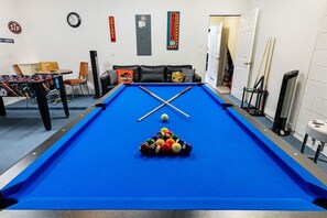 Fun filled game room with pool table, foosball, air hockey and TV