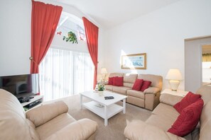 The Family Lounge is a haven of relaxation, offering a cozy and inviting space to unwind while enjoying picturesque views of the pool deck