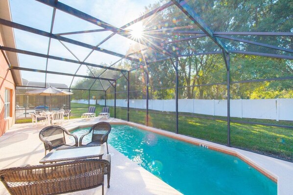 Indulge in a true Floridian escape at Seasons Florida Resort, where the spacious pool deck offers a serene and welcoming retreat for relaxation, fun, and socializing.