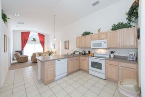 An open kitchen that flows seamlessly into the living room is the epitome of modern design, creating a versatile and welcoming space.