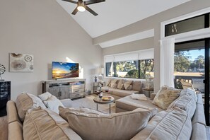 Spacious living area with a lovely large patio and serene golf views.