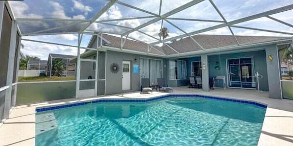 Enjoy sunny days and quiet evenings in this screened-in private pool area. Located in Orlando, Florida, and just minutes from Disney, it's your perfect vacation hideaway.