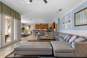 The living area is designed for comfort and relaxation, featuring plush sofas and armchairs arranged to encourage conversation and leisure.