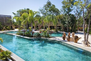 The shared pool, a serene escape surrounded by greenery.