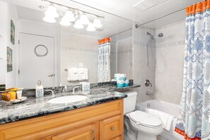 Full bathroom with tub and shower combination