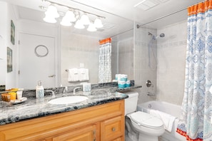 Full bathroom with tub and shower combination