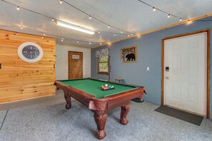 There is fun for all in the Game Room with pool table and arcade games 