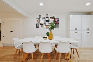 Home is where the bellies are filled! Furnished with sleek chairs, modern accents, and modern wall art, this dining room is a comfortable and welcoming environment to enjoy your meals.