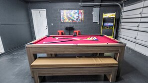 Pool table / table tennis, and an arcade machine featuring over 2600 games. 