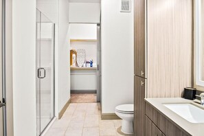 You feel a sense of calm as you enter the bathroom, where the thoughtful design and high-quality materials create a serene environment.