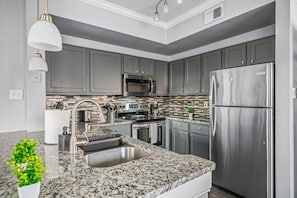 The kitchen invites you to experiment with new recipes, offering a stylish and practical space to cook and create.
