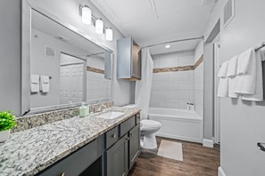 You feel a sense of calm as you enter the bathroom, where the thoughtful design and high-quality materials create a serene environment.