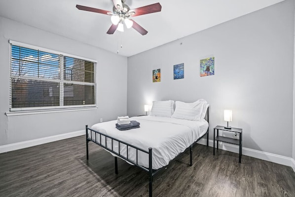 The bedroom offers a luxurious retreat, with a bed that promises restful nights and a room that feels like a private oasis.