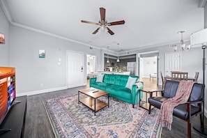 You are surrounded by tasteful decor and warm tones, making the living room a perfect setting for any occasion.