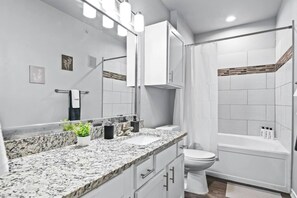 As you step into the bathroom, the clean lines and soothing colors create a space where you can relax and refresh.