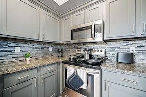 As you step into the kitchen, the clean lines and functional design make you eager to start cooking your favorite dishes.