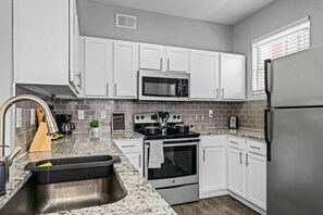 As you step into the kitchen, the clean lines and functional design make you eager to start cooking your favorite dishes.