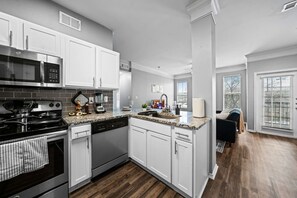 You can almost hear the sizzle of ingredients as you cook in the well-equipped kitchen, where every detail is designed for convenience.