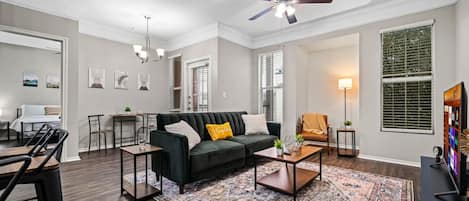 You feel at home as you settle into the living room, where the inviting atmosphere is perfect for lounging or entertaining.