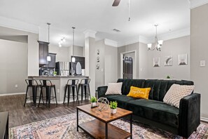 As you take a seat in the living room, the comfortable furniture and tasteful design make it easy to unwind.