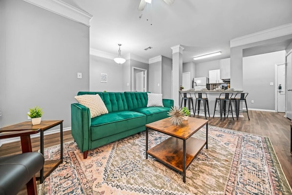 Once you enter the living room you'll find a space that feels both luxurious and cozy, perfect for unwinding after a long day.