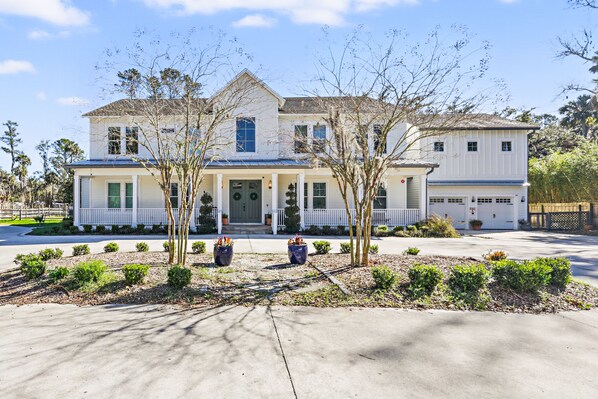 Front view of home facing the organic garden with a welcoming front porch