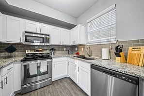 As you step into the kitchen, the clean lines and functional design make you eager to start cooking your favorite dishes.