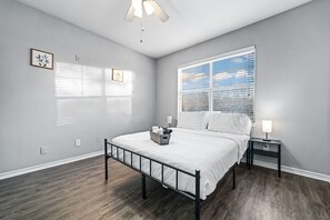 The bedroom’s serene ambiance invites you to relax, with a plush bed that promises a restful night's sleep.