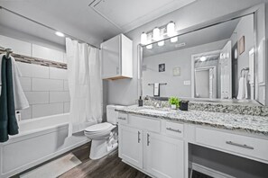 Step into this sparkling clean bathroom, offering you a refreshing retreat. Enjoy a hot shower surrounded by serene forest vibes, and wrap yourself in soft towels after a long day of exploring or relaxing.