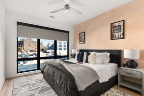 Wake up to stunning city views in this serene and stylish Nashville bedroom!