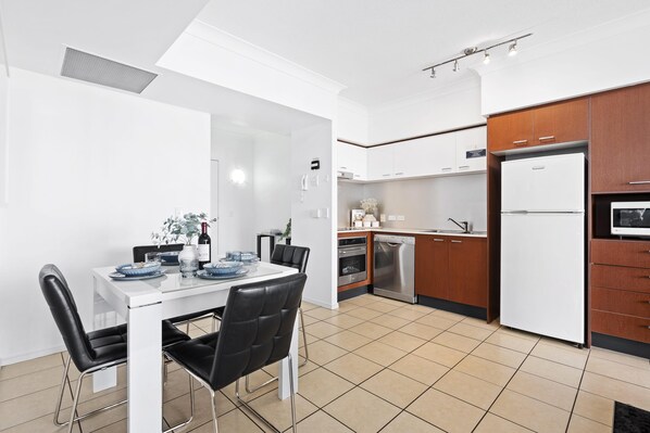 Dining area is right next to the fully equipped modern kitchen
