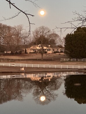 Rear view of home from pond behind the house