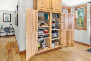 Well stocked with appliances, cookware and place settings for extended stays.