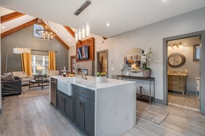 Modern kitchen with sleek countertops, stainless steel appliances, and a spacious island—ready for meals and memories!