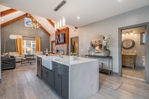 Modern kitchen with sleek countertops, stainless steel appliances, and a spacious island—ready for meals and memories!