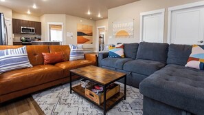 Game night anyone? The living room boasts comfy seating and a basket full of board games for endless fun.