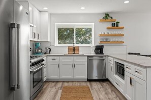 A bright, sleek kitchen where style meets functionality in every corner.
