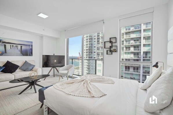Enjoy the city and partial ocean view right from your bed