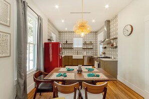 Spacious main dining table that sits 5 with full tableware and silverware included.