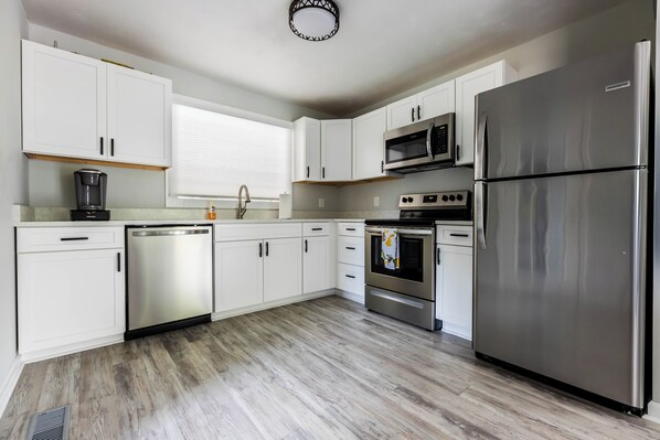 Fully equipped with stainless steel appliances and ample counter space