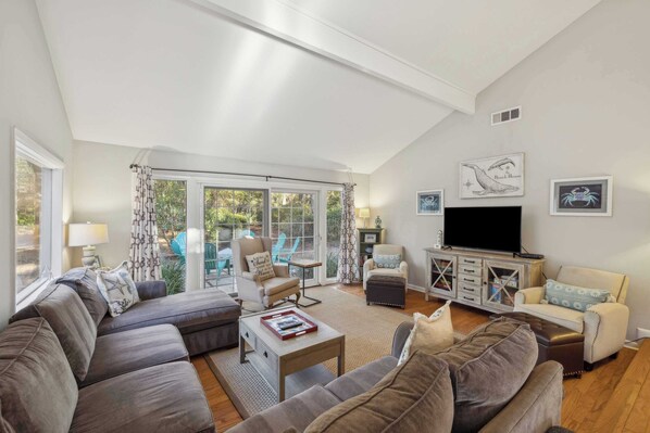 Curl up in the coastal chic living room & enjoy a movie night at home